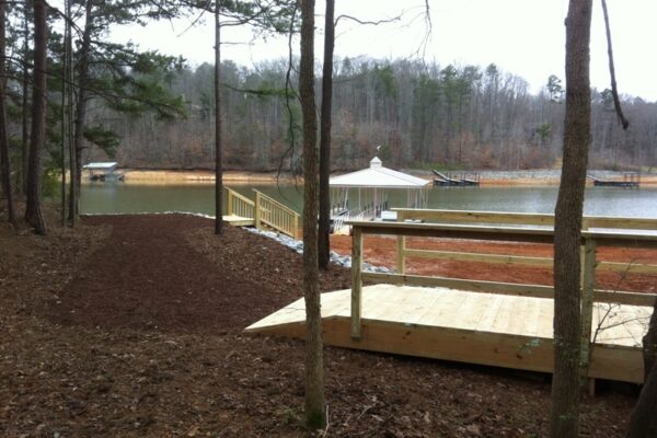 A dock with a connecting path bridge, enhancing access and scenic appeal.