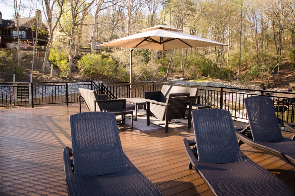 A dock featuring a sun deck, offering a perfect spot for relaxation and waterfront enjoyment.
