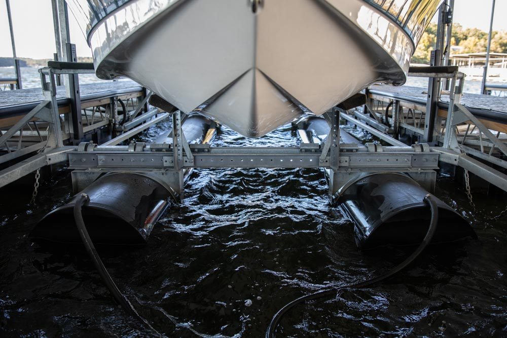 DuraTek HD Series boat lift with V-hull boat raised